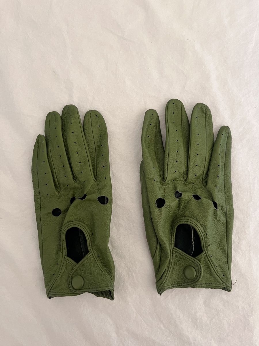Pair of green gloves on a white background