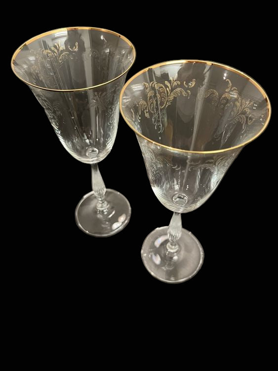 Elegant antique wine glasses with gold rim