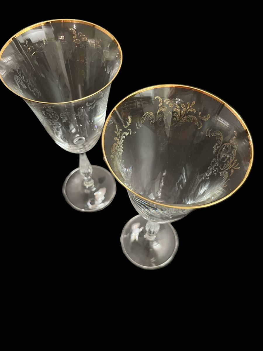 Elegant antique wine glasses with gold rim