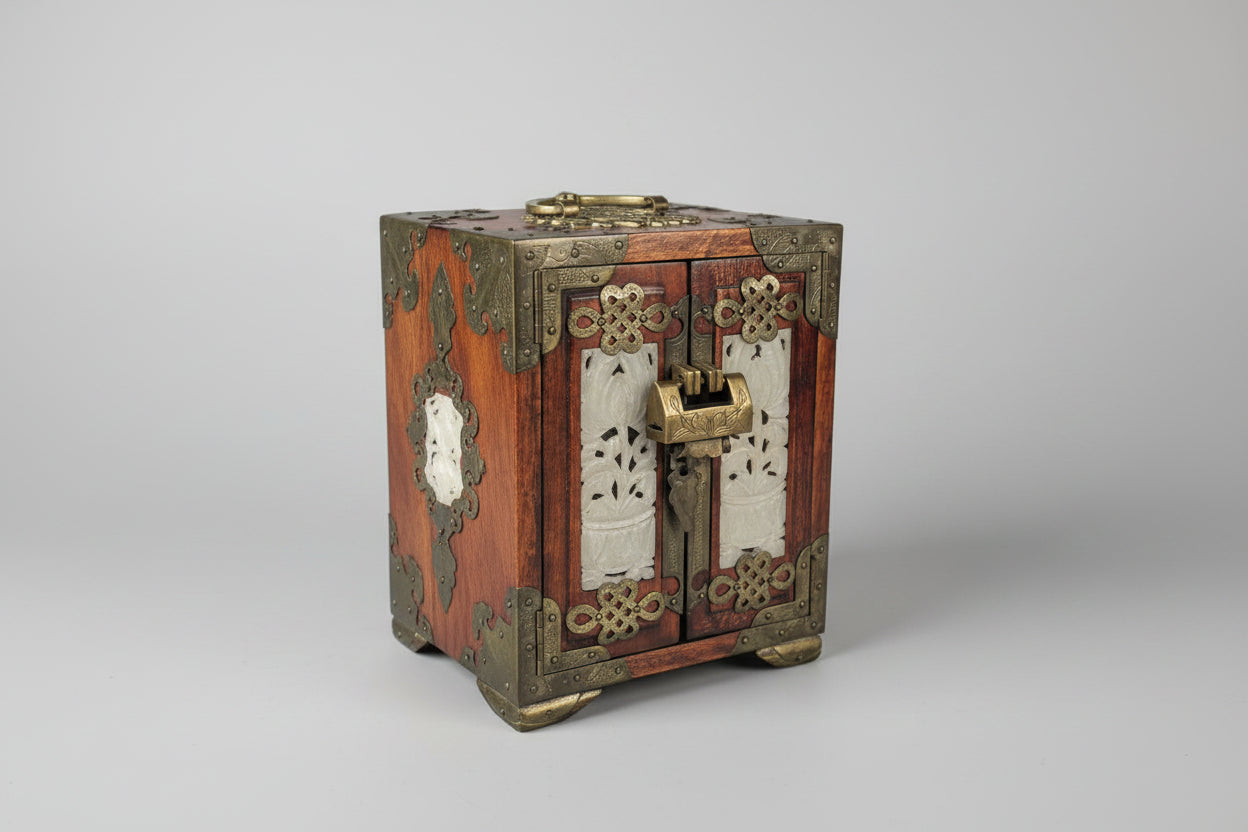 Decorative wooden box with metal accents on a dark surface