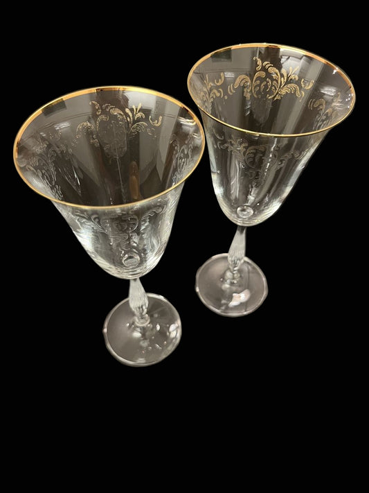 Elegant antique wine glasses with gold rim