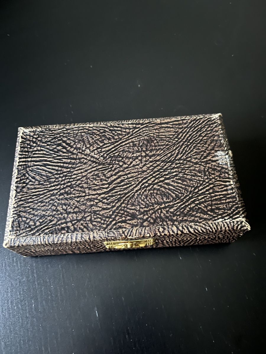 Textured rectangular box on a black background